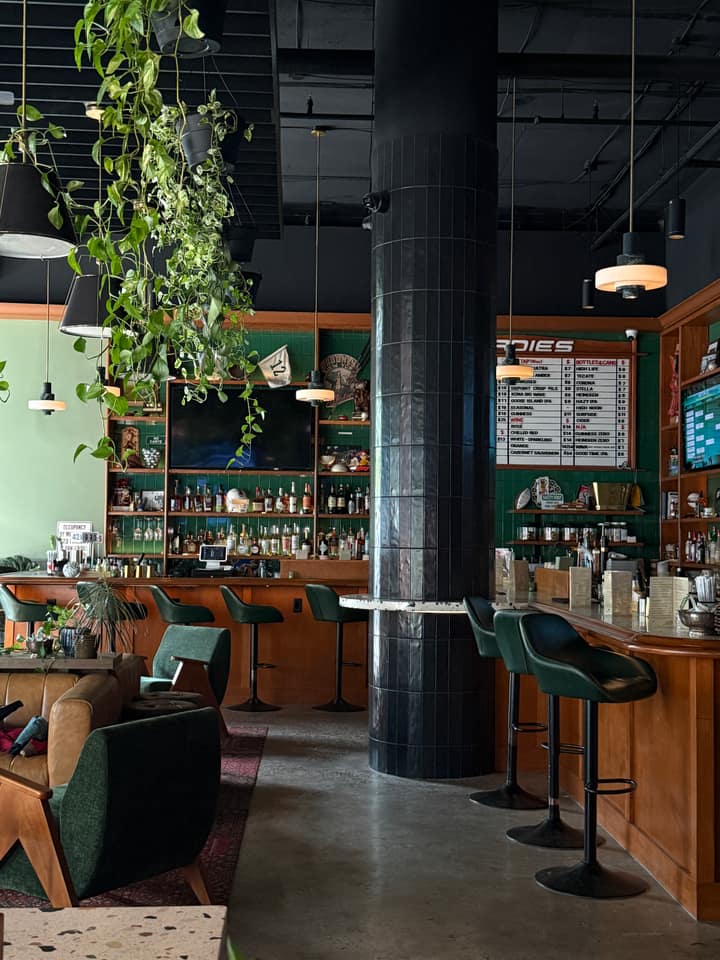 Stools, bottles, greenery